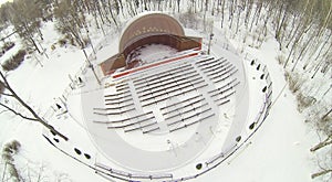 Small outdoor amphitheater in winter snowy park. photo