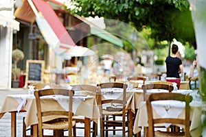 Small outdoor restaurants at the pedestrian area at center of Kalavryta town near the square and odontotos train station, Greece