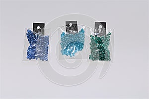 Small packs of different kind of blue colored shiny silver lined glass beads