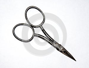 Small pair of metal scissors isolated on white