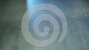 Small airborne particles moving around in the light