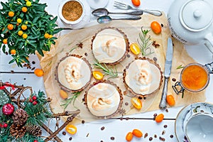 Small Pastry Tartlets Filled with Vanilla Cream, Lemon Curd and Fresh Berries on Rustic White Wooden Table