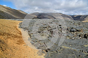 Small path next to solidified lava field from Geldingadalir volcano photo