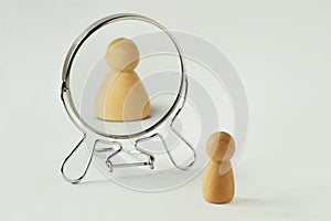 Small pawn looking in the mirror and seeing itself fat - Concept of dysmorphobia, anorexia, distorted self-image