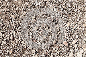 Small pebble stone background texture closeup detailed natural light