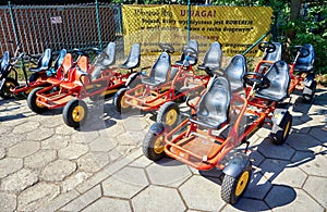 Small pedal go-kart rental cars for children in a row ready for use