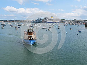 A small pedestrian ferry takes people from St Mawes on Roseland Peninsula across the water to Falmouth photo