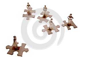 Small people on puzzle pieces