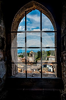 The small picturesque town Sirmione by the Lake Garda in Italy framed in a window