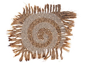 Small piece of old burlap, hessian fabric with frayed edges, isolated on white. Old, worn and singed. Sackcloth.