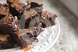 small pieces of brownies on white plate