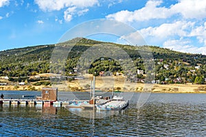 Small pier with little boat at Lake Cuyamaca, California, USA