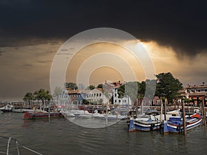 a small pier in venice with boats