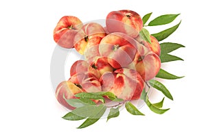 Small pile of flat fig peaches with branch isolated on white