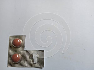 small pills with big efficacy on a plain white background