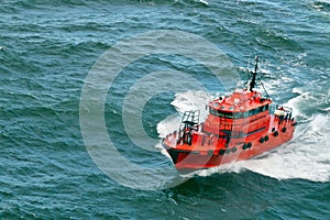 Small pilot boat sailing in the ocen