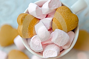 Small pink marshmallow with biscuits in the cup