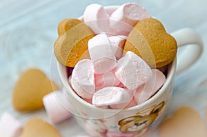 Small pink marshmallow with biscuits in the cup