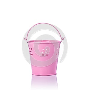 Small pink vintage metal bucket. Studio shot isolated on white