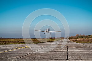 Small plane in the air. Blue sky