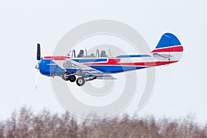 Small plane at the airport in winter