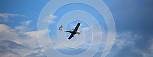 Small plane on blue sky background