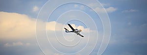 Small plane on blue sky background