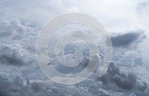 Small plane in cloudy sky for rainmaking. White fluffy clouds with small aircraft to make artificial rainfall. Two airplane flying