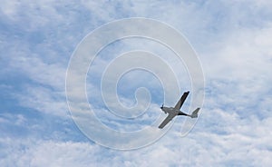 small plane flying low in the sky with space for text