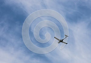 small plane flying low in the sky with space for text