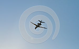 small plane flying low in the sky with space for text