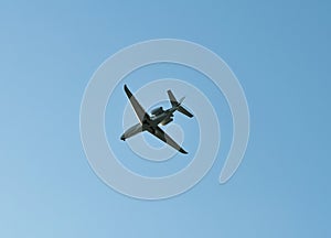 small plane flying low in the sky with space for text