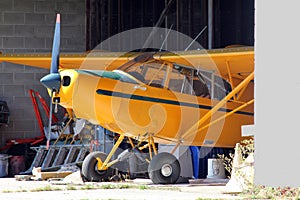 Small plane inside hangar