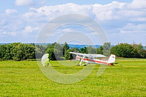 Small plane lifts parachutists to a high altitude for parachute jumping