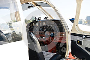 Small plane on the runway, airplane barn, Cockpit of small private lightweight vintage airplane closeup image