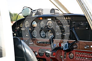 Small plane on the runway, airplane barn, Cockpit of small private lightweight vintage airplane closeup image