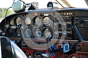 Small plane on the runway, airplane barn, Cockpit of small private lightweight vintage airplane closeup image