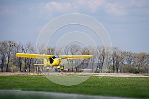 Small Plane Taking Off from green field. Concept of increase and development