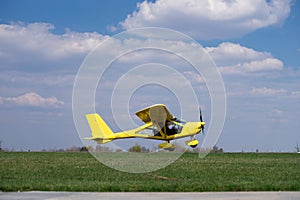 Small Plane Taking Off from green field. Concept of increase and development