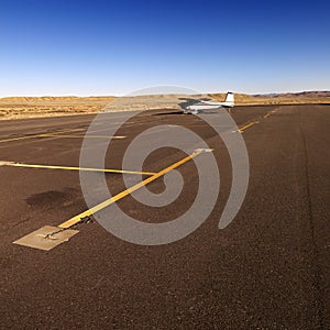 Small plane on tarmac at airport.