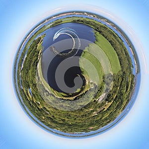 Small planet transformation of a spherical 360 degree panorama. Spherical abstract aerial view. Curvature of space