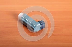 Small pocket inhaler on the background of table