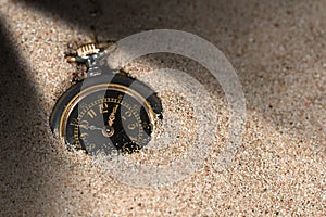 Small Pocket watch in the Sand