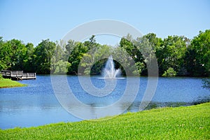 A small pond and geyser in a Florida community