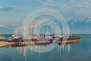 Small port with many boats on sunset