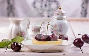 Small portion chessecake decorated with sweet cherries