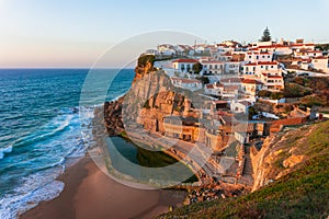 Small Portugal village Azenhas do Mar on cliff on coastline photo