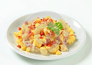 Small potato dumplings with bacon and cabbage