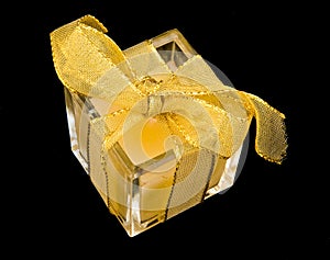 Small present but wrapped with gold ribbon.