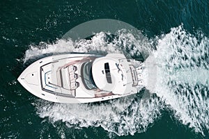 Small private yacht in the sea with beautiful turquoise wave in ocean.